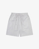 Front flat shot of Uskees off-white shorts for men. Clear view of drawstring, elasticated waist and Uskees branding label.