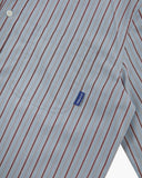 Uskees sky blue and claret terrace pinstripe men's advanced Oxford shirt showing a detailed look at the pattern with a focus on the breast pocket.