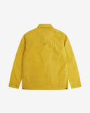 Reverse view of the British yellow Uskees wax storm jacket showing the boxy silhouette, Halley Stevenson dry wax fabric, hanging loop and adjustable hem.