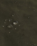 Magnified view of the dry waxed fabric, demonstrating the material's water repellant properties.