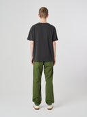 Back view of model wearing 7006 faded black organic cotton t-shirt.