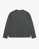 Back view of the Uskees dark green organic cotton jersey long-sleeved T-shirt with loose silhouette.