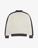 Back flat view of a men's Uskees cream track jacket with purple accents on a white background.