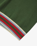 Close-up of an Uskees brown men's tank top with a striped hem featuring red, blue and white colors.