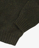 Closer view of Alderney crew neck jumper in Scottish new wool from Uskees. Focus on cuff, hem, multicoloured speckles and wool texture.