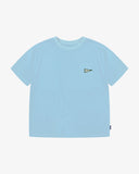 Front flat shot of an Uskees pale blue men's t-shirt with a small pennant graphic and uskees brand tab clearly visible.