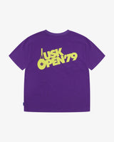 Back view of the Uskees purple organic cotton jersey T-shirt showing the bold tennis open graphics in yellow and the loose silhouette.
