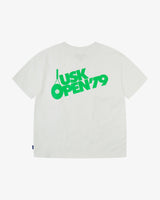 Back view of the Uskees white organic cotton jersey T-shirt showing the bold tennis open graphics in green and the loose silhouette.