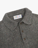 Close up of the neckline of an Uskees speckled grey men's sweater showing the collar and buttoned placket.